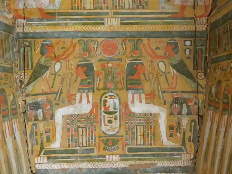 Two bearded egyptians sitting and two winged humans